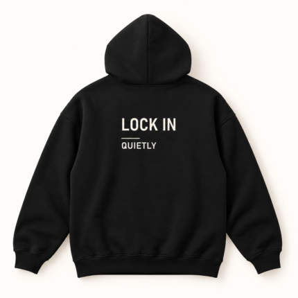Back of black hoodie with LOCK IN, a thin divider, and QUIETLY printed in off-white